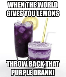 Icy purple beverage in tall glass with lemon wedge, foamy purple beverage with yellow st
